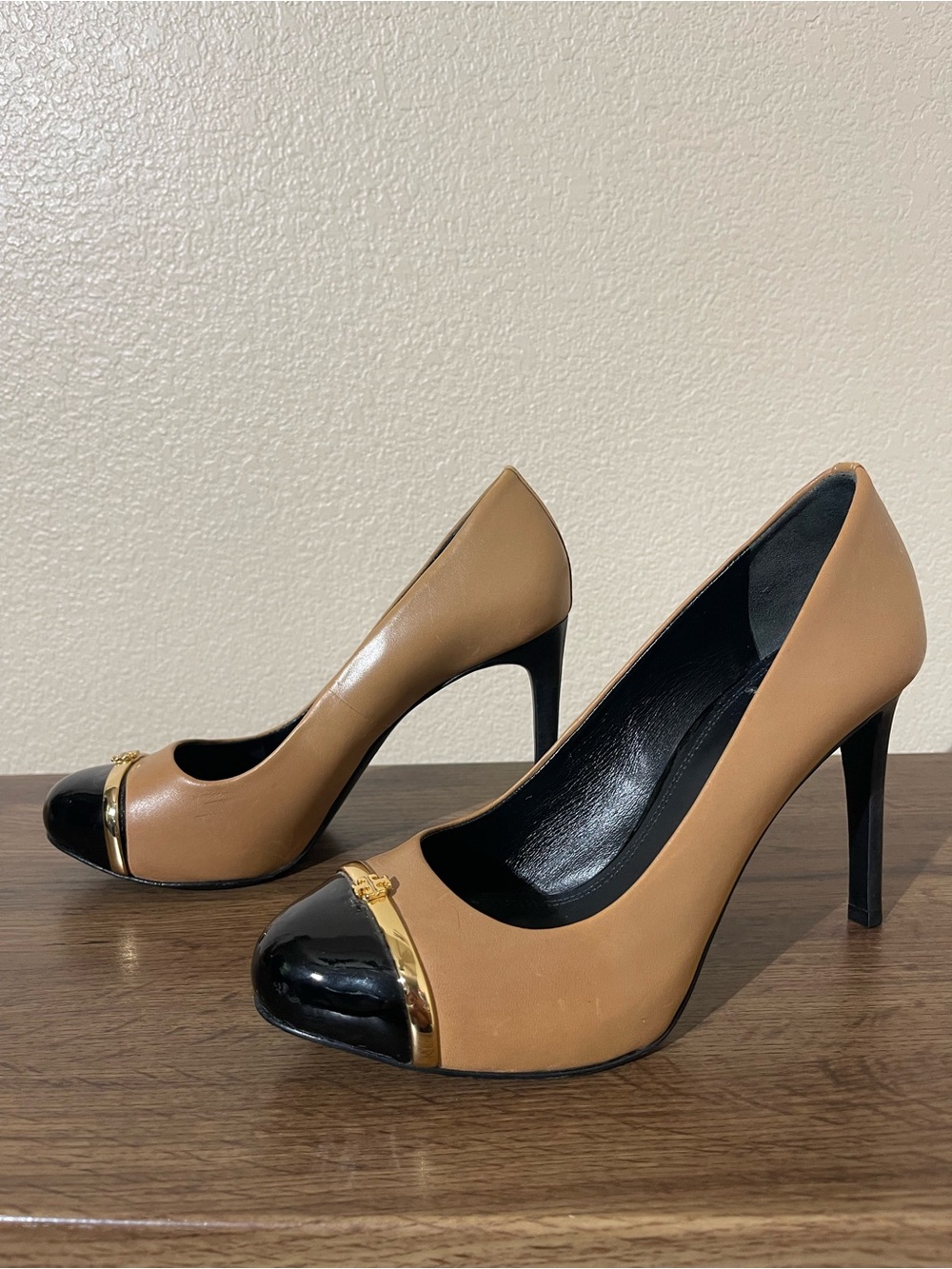 Tory Burch Two-Tone Tan and Black Cap-Toe Pumps with Gold Accent